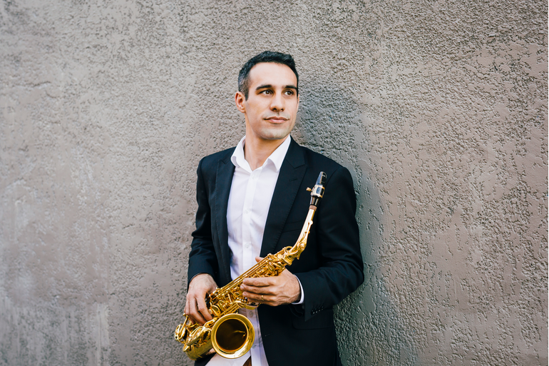 Nick Russoniello holding a saxophone